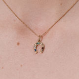 Şener Besim Horseshoe With Gems Charm worn as a necklace pendant