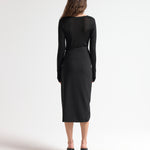 model wearing insert skirt with asymmetric waist and ruching detail by sener besim