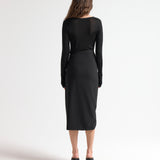 model wearing insert skirt with asymmetric waist and ruching detail by sener besim