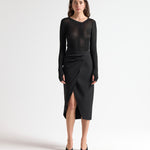 model wearing sener besim insert skirt with ruched detail side split 