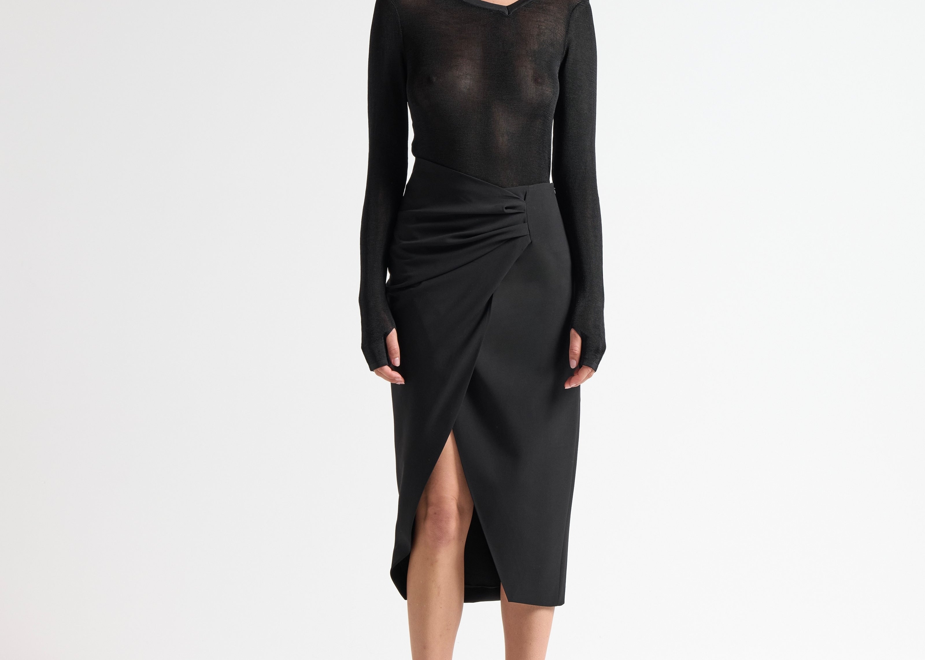 model wearing sener besim insert skirt with ruched detail side split 