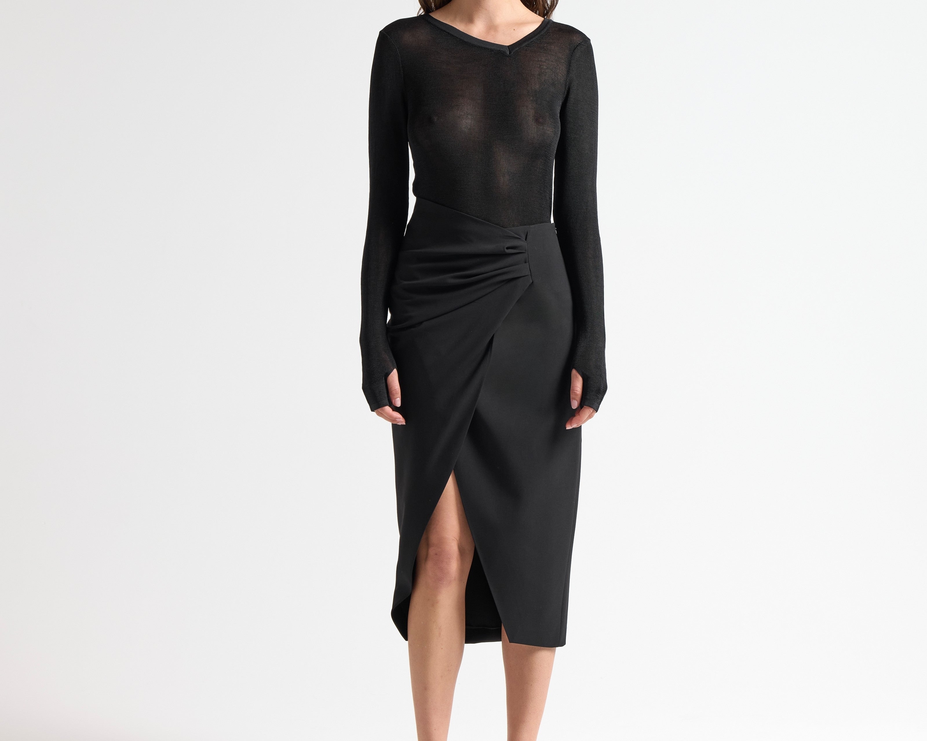 model wearing sener besim insert skirt with ruched detail side split 