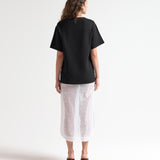 model back view of knitted oversized tee by sener besim