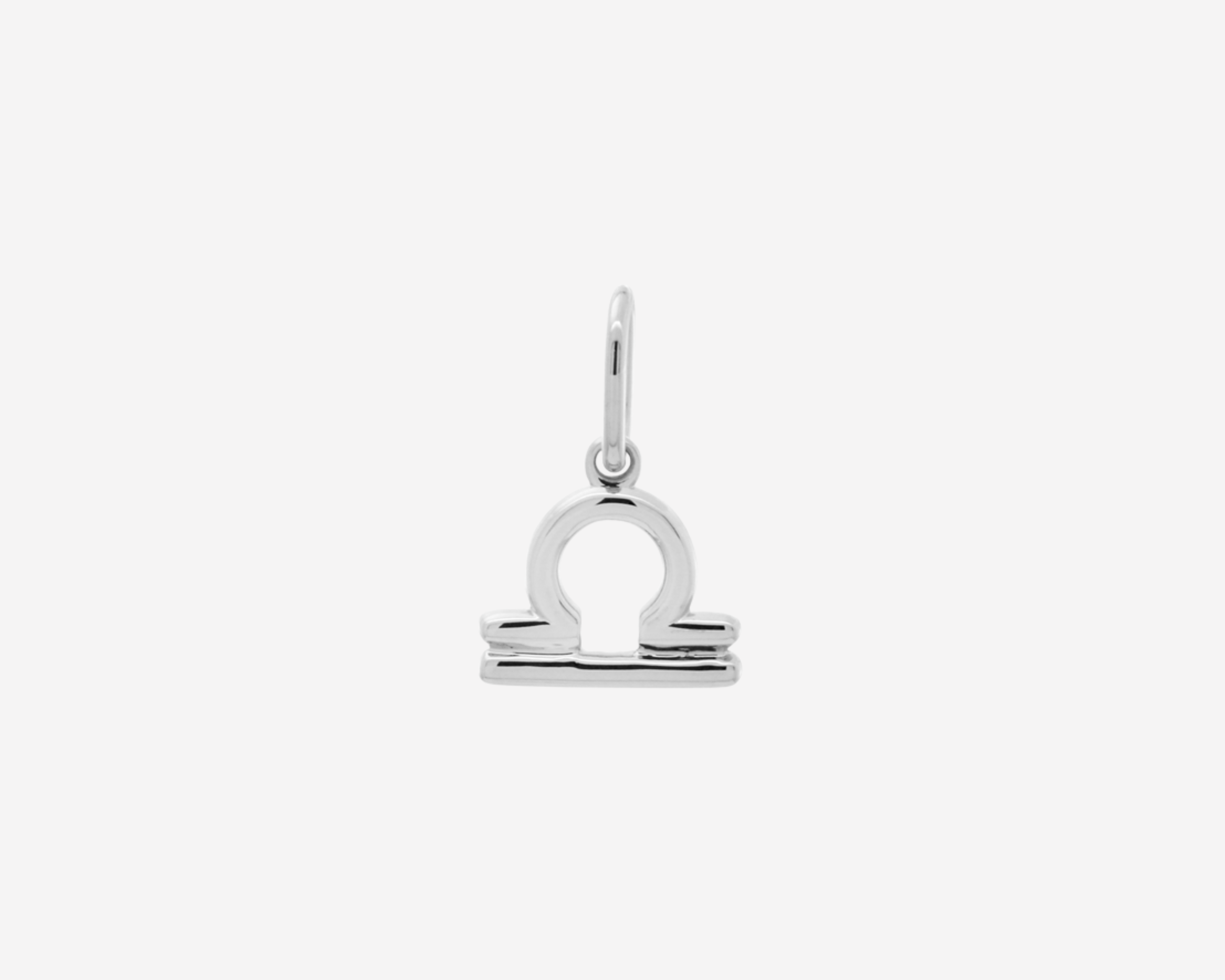 Şener Besim Libra Charm in silver rhodium plating, flat lay
