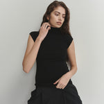 Şener Besim Merino Cap Sleeve Top in Black, close-up styling detail
