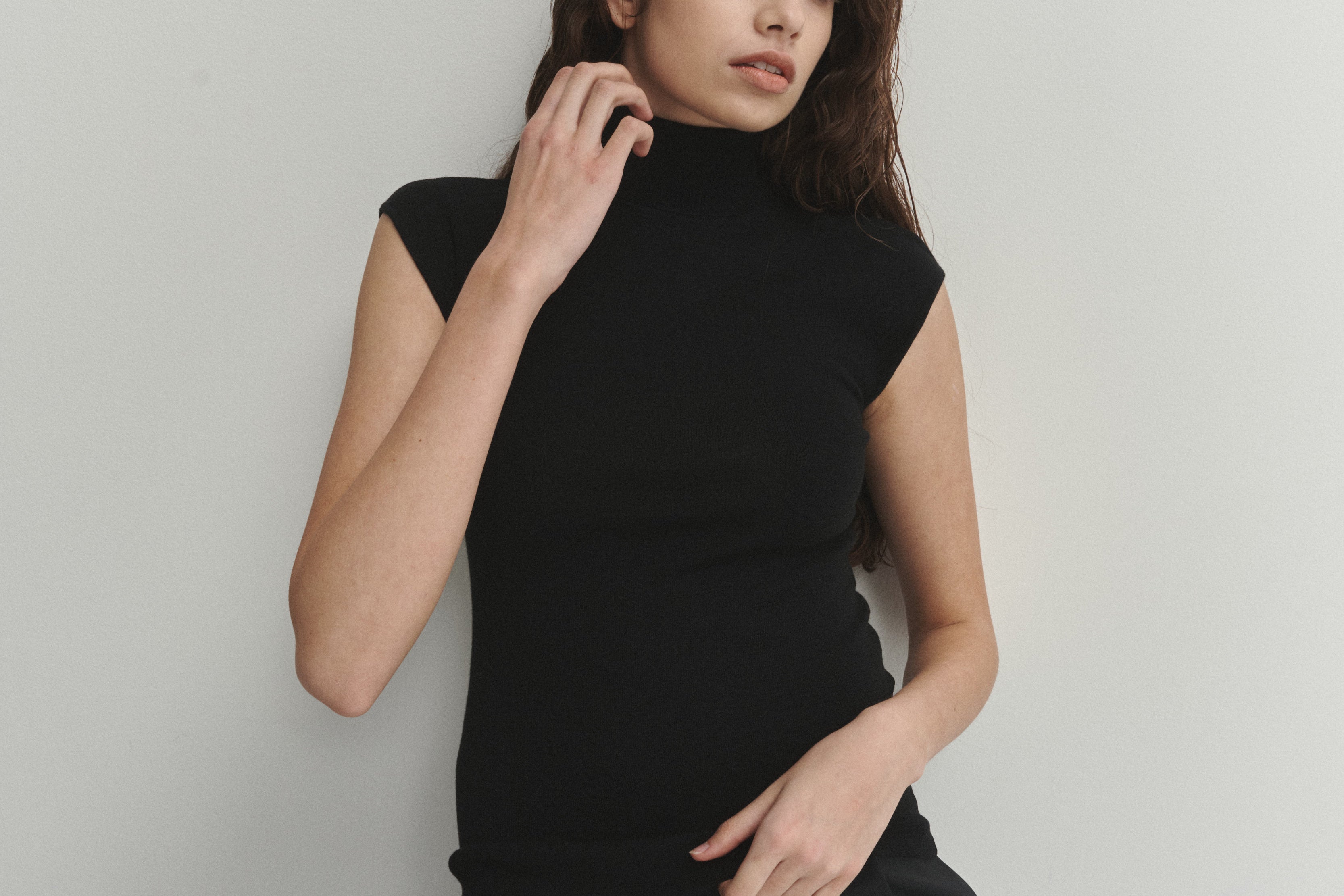 Şener Besim Merino Cap Sleeve Top in Black, close-up styling detail