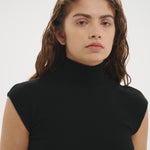 Şener Besim Merino Cap Sleeve Top in Black worn close-fitted, front view