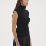 Şener Besim Merino Cap Sleeve Top in Black, side profile showing the high turtleneck