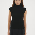 Şener Besim Merino Cap Sleeve Top in Black, styled with black wide-leg trousers