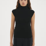 Şener Besim Merino Cap Sleeve Top in Black, styled with black wide-leg trousers