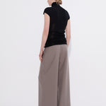 Black merino cap sleeve turtleneck top, back view — Şener Besim