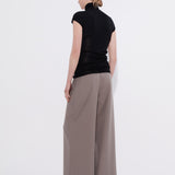 Black merino cap sleeve turtleneck top, back view — Şener Besim