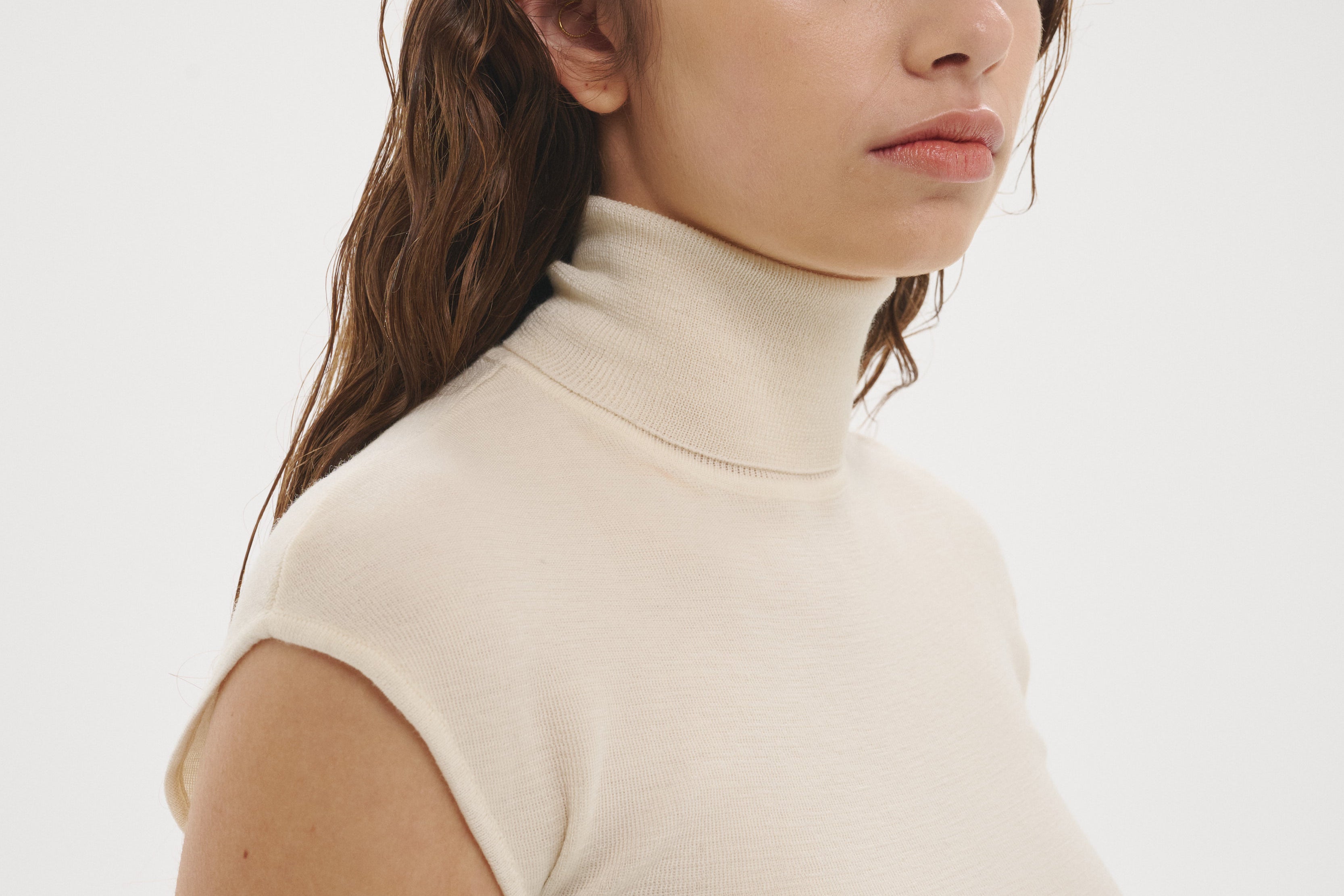 Şener Besim Merino Cap Sleeve Top in White, angled view showing the cap sleeve