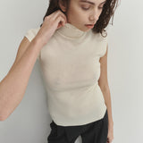 Şener Besim Merino Cap Sleeve Top in White, close-up styling detail