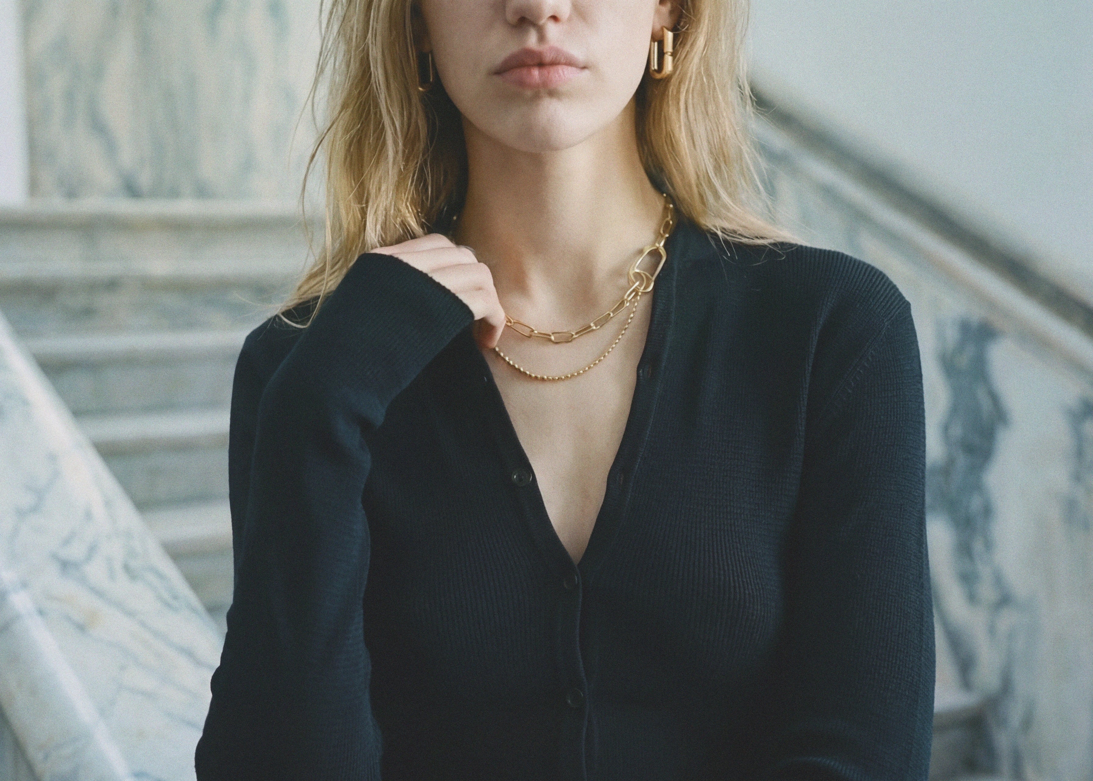 Black merino wool button cropped cardigan, front view — Şener Besim