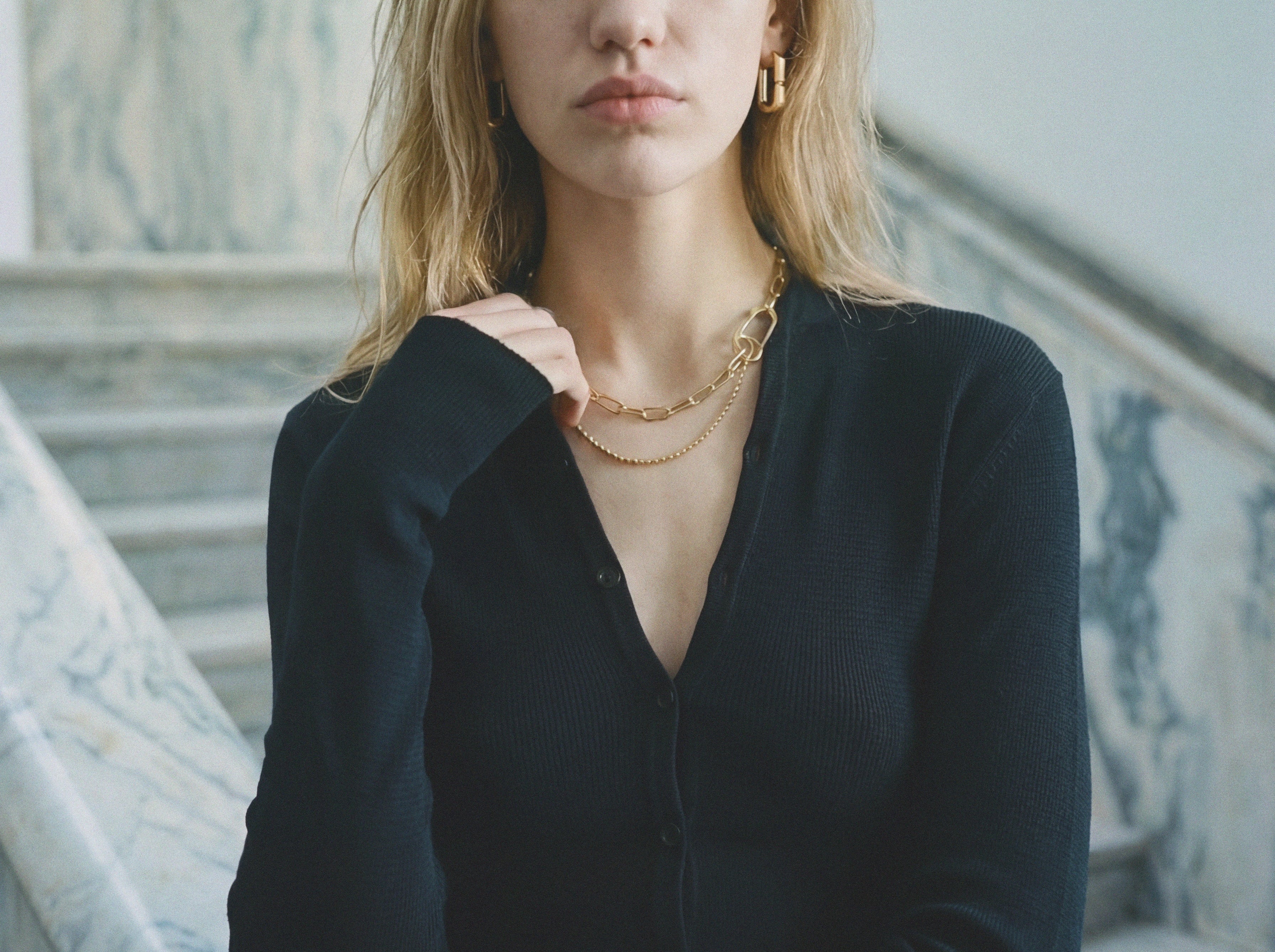 Black merino wool button cropped cardigan, front view — Şener Besim