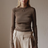 Şener Besim Merino Thumbhole Crewneck in putty, worn