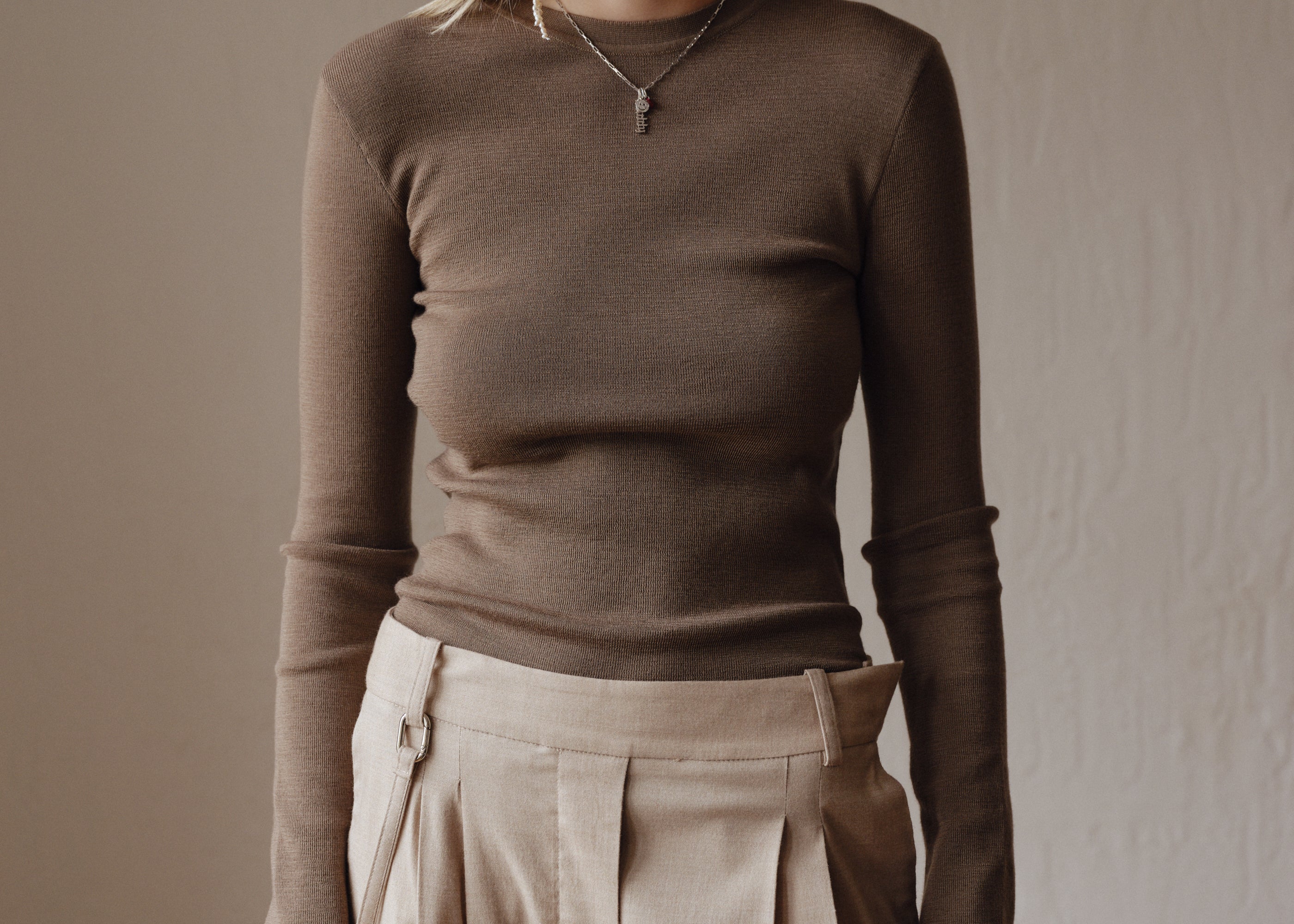 Şener Besim Merino Thumbhole Crewneck in putty, worn