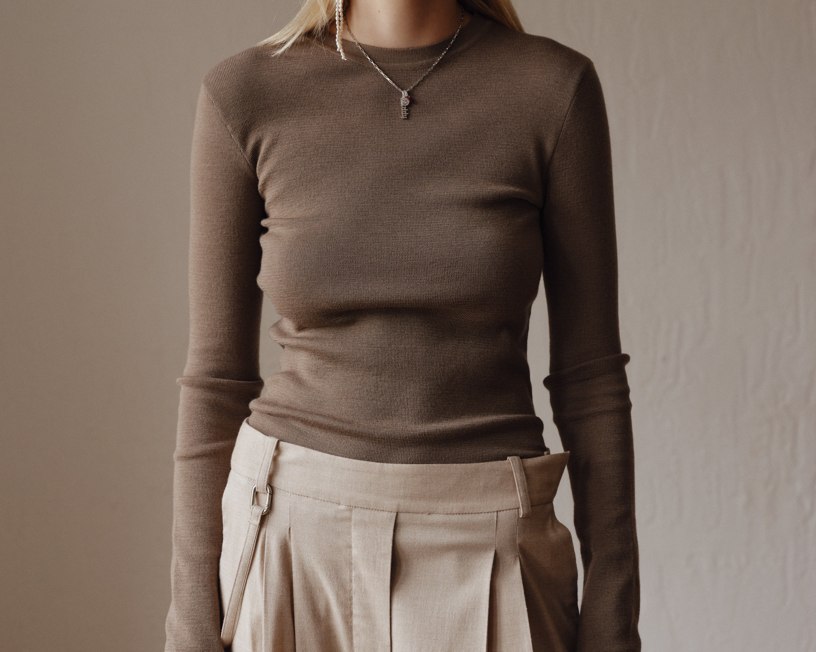 Şener Besim Merino Thumbhole Crewneck in putty, worn