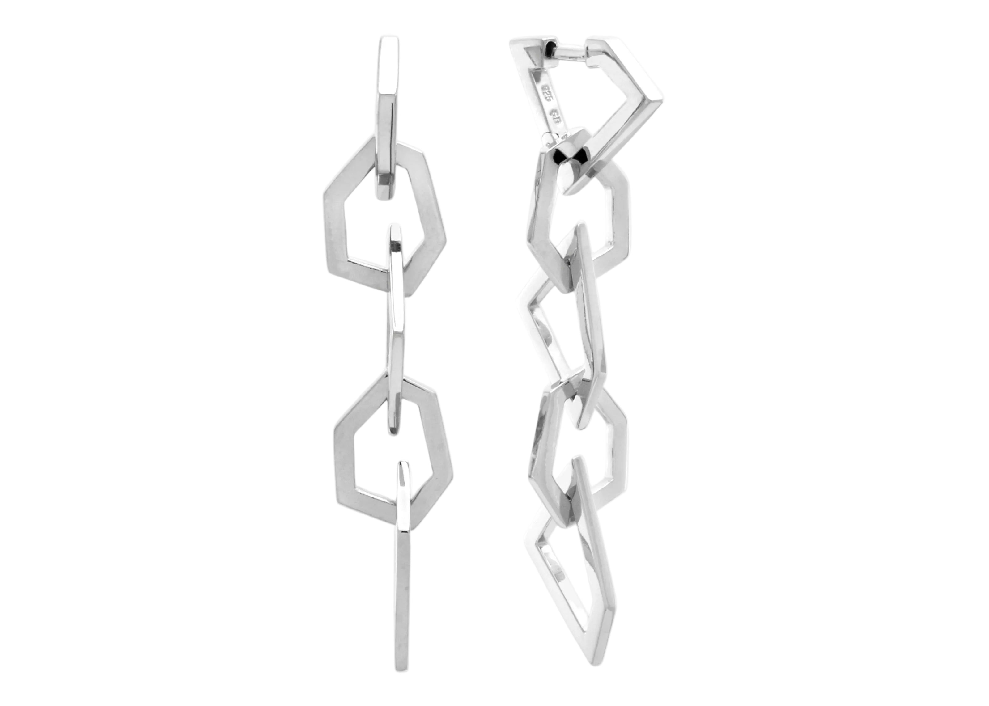 Şener Besim Mosaic Long Earring in rhodium plating, five geometric chain links, flat lay