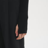 Close-up of the Şener Besim Multibutton Cardi in Black sleeve and knit detail