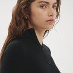 Şener Besim Multibutton Cardi in Black worn close-fitted, portrait view