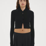 Şener Besim Multibutton Cardi in Black, worn open over black wide-leg trousers