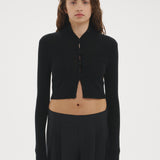 Şener Besim Multibutton Cardi in Black, worn open over black wide-leg trousers