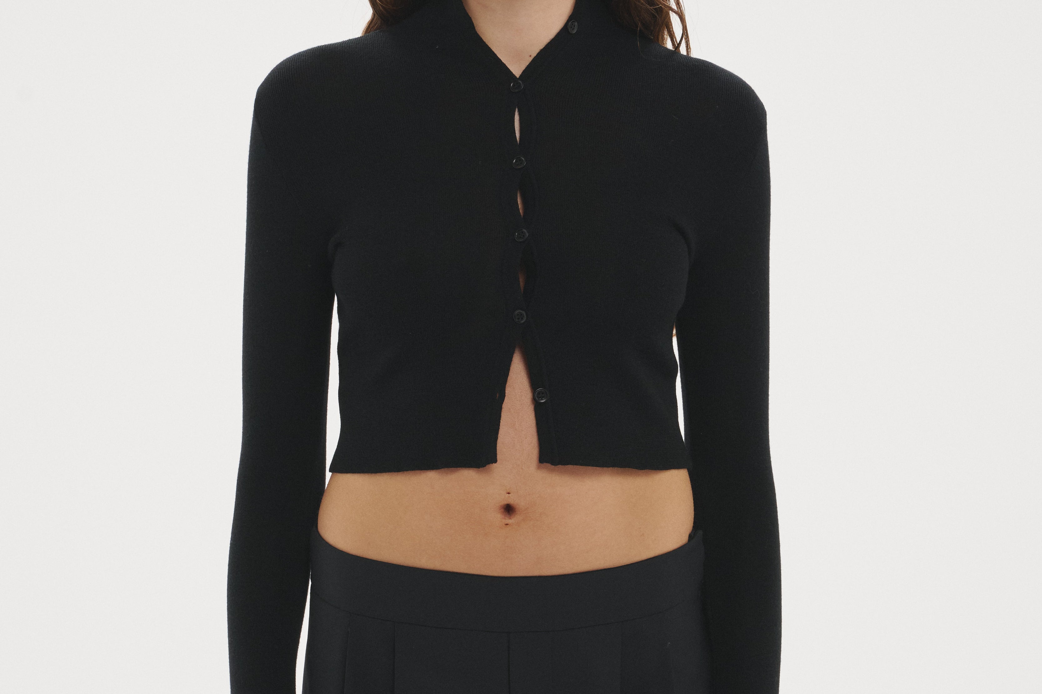 Şener Besim Multibutton Cardi in Black, worn open over black wide-leg trousers