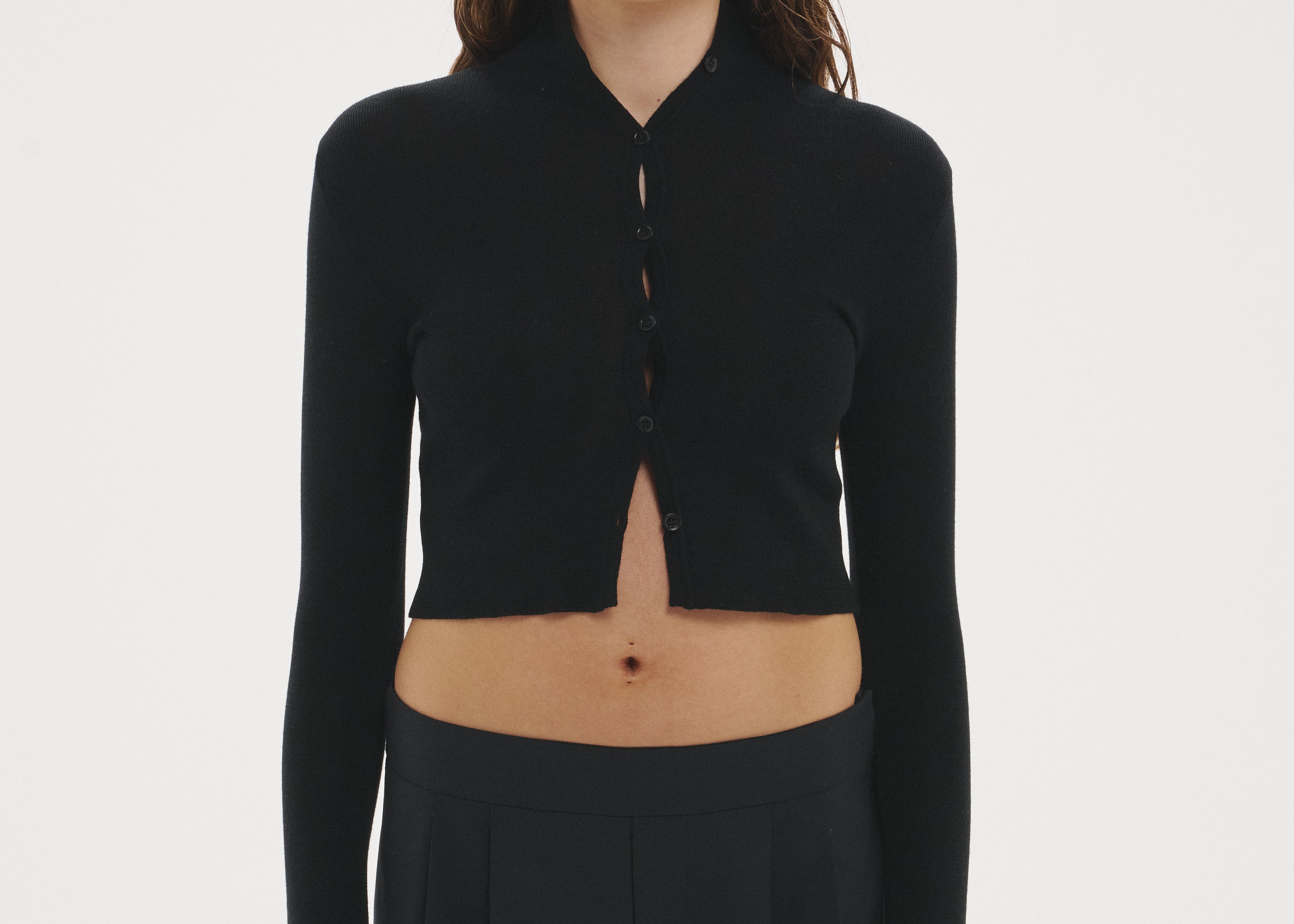 Şener Besim Multibutton Cardi in Black, worn open over black wide-leg trousers