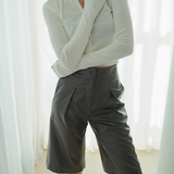 Multibutton chiffon cardigan in off white styled with grey shorts — Şener Besim
