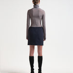 back view of a mini length sener besim bonded pencil skirt in navy 