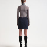 back view of a mini length sener besim bonded pencil skirt in navy 