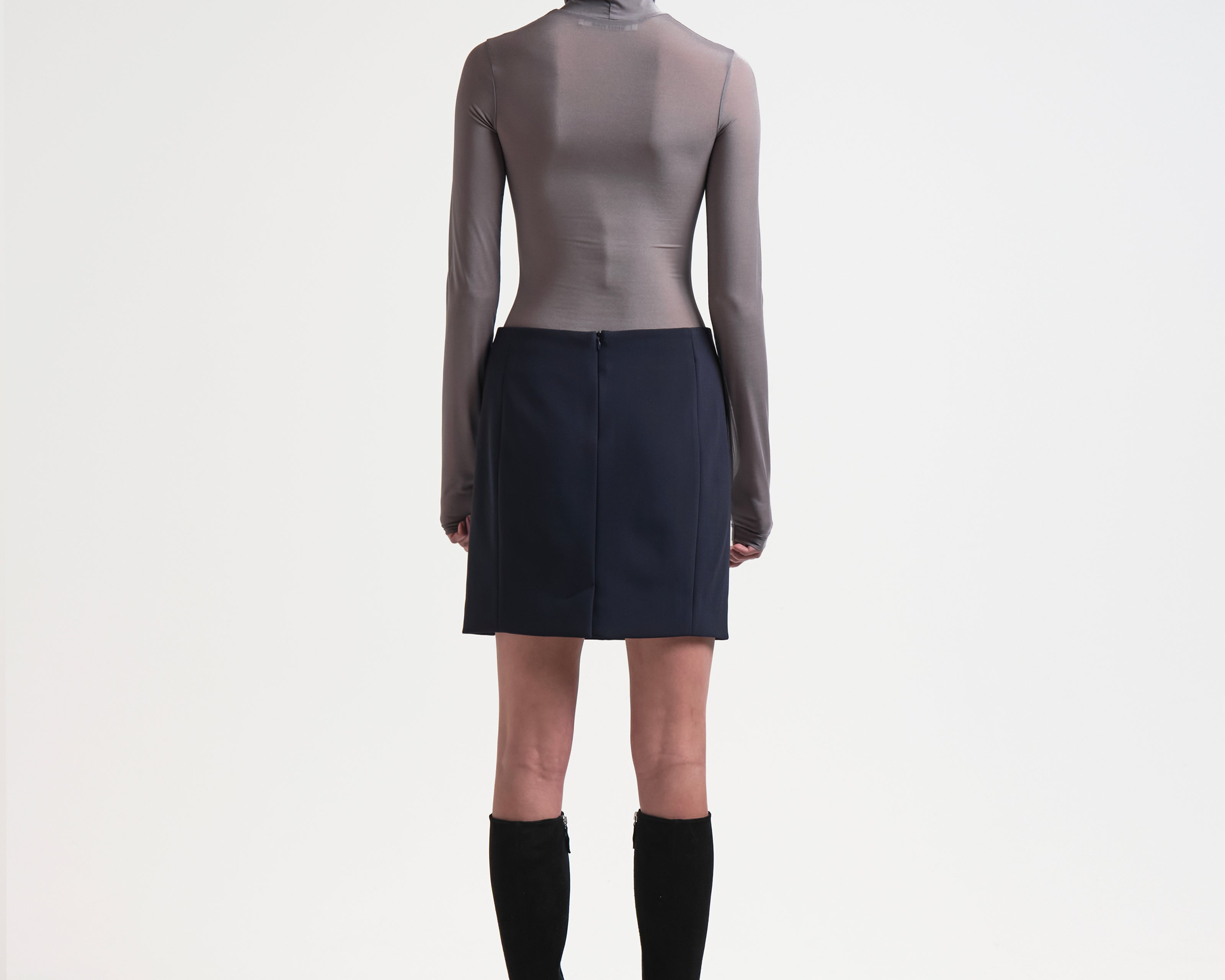 back view of a mini length sener besim bonded pencil skirt in navy 