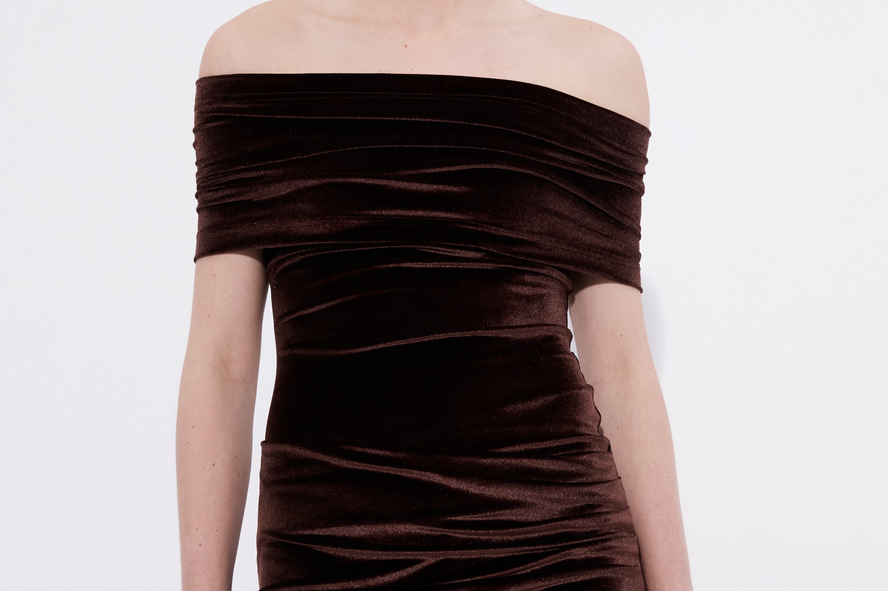 Şener Besim Off Shoulder Mini Dress in chocolate velvet, worn close up