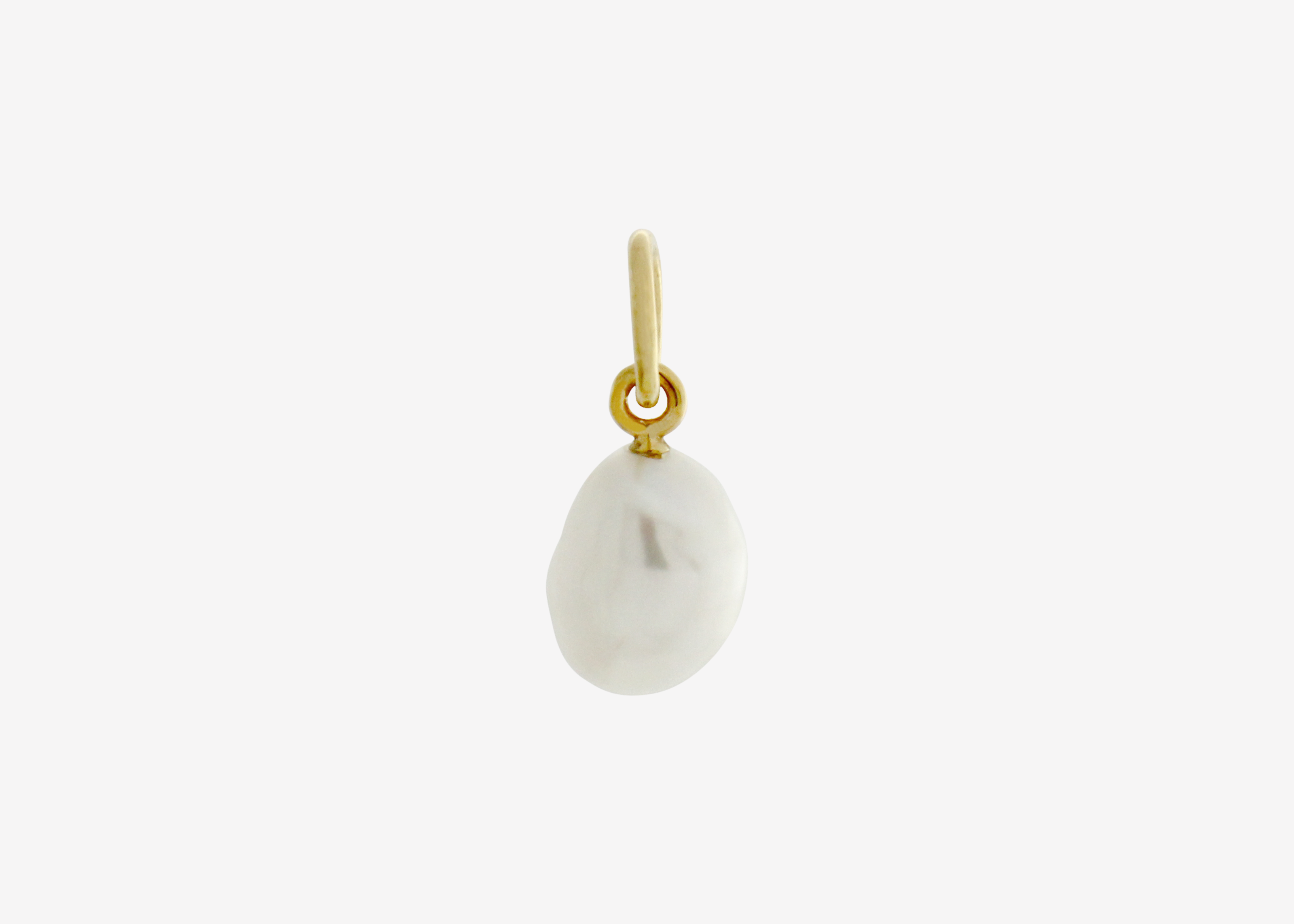 Pearl charm gold plating on white background — Şener Besim
