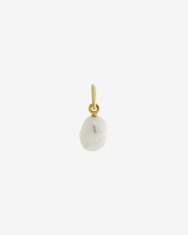 Pearl charm gold plating on white background — Şener Besim