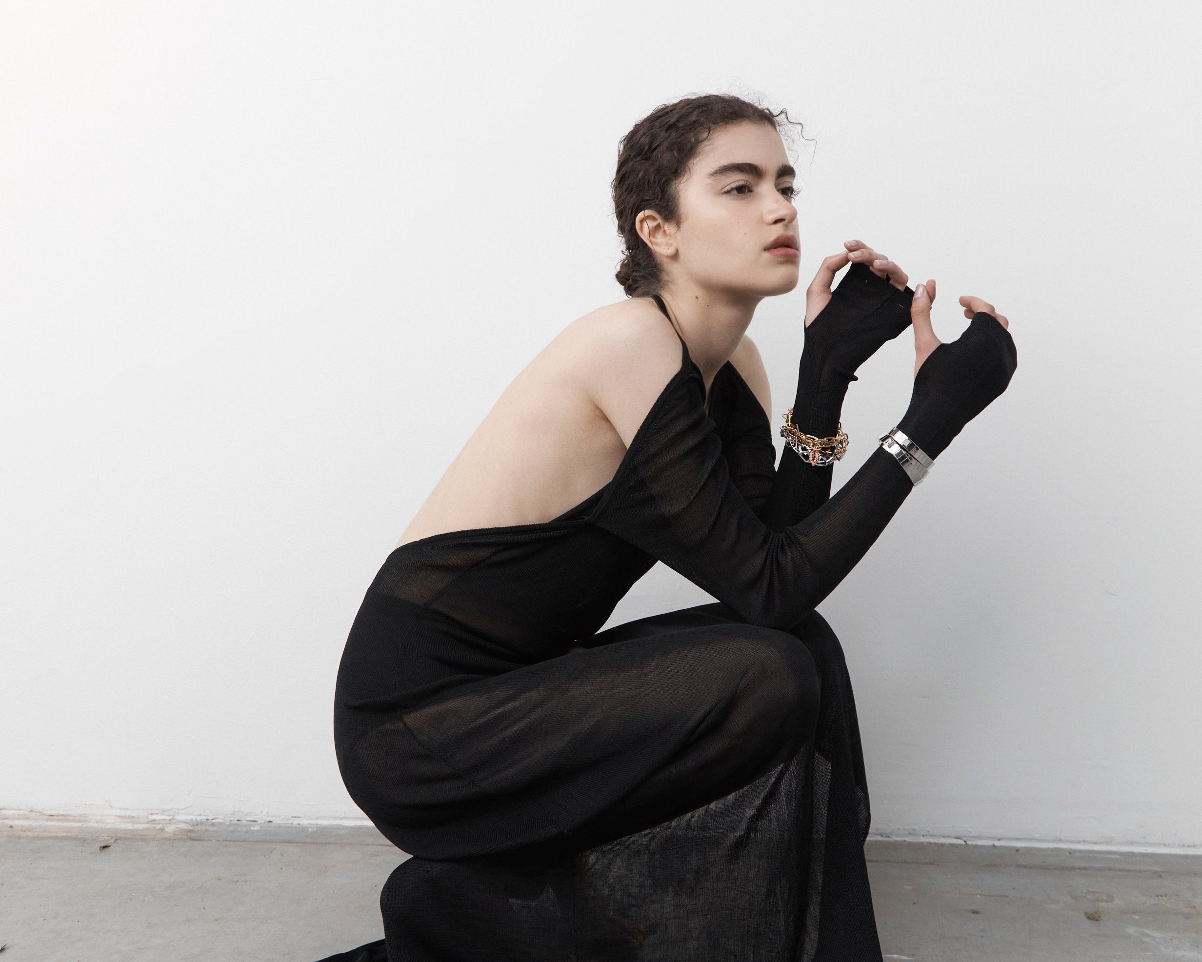 Şener Besim Ready to Wear collection — woman in black ensemble, campaign imagery