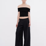 Şener Besim black off shoulder top styled with wide leg pants