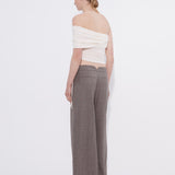 Şener Besim white off shoulder top styled with wide leg trousers