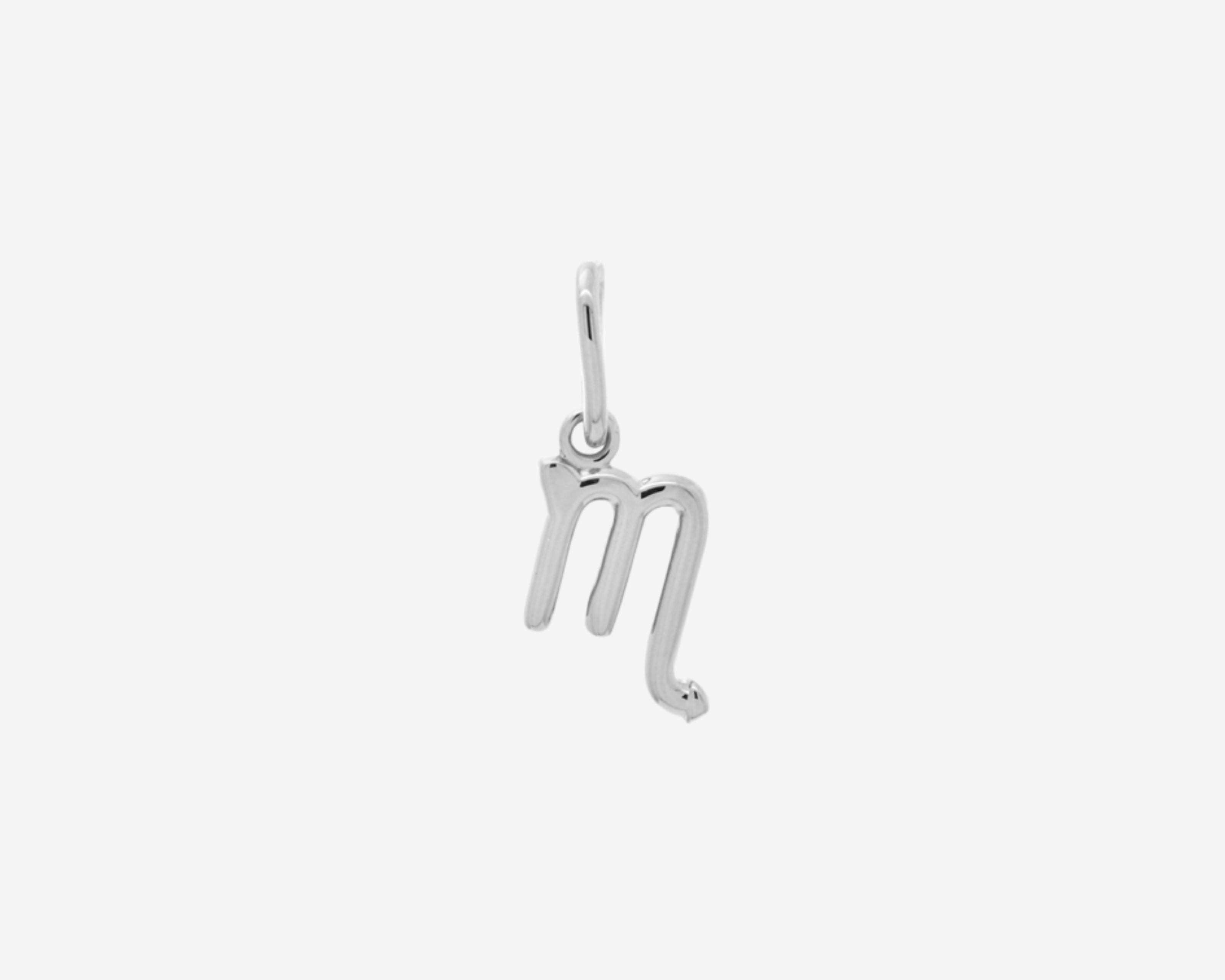 Şener Besim Scorpio Charm in silver rhodium plating, flat lay