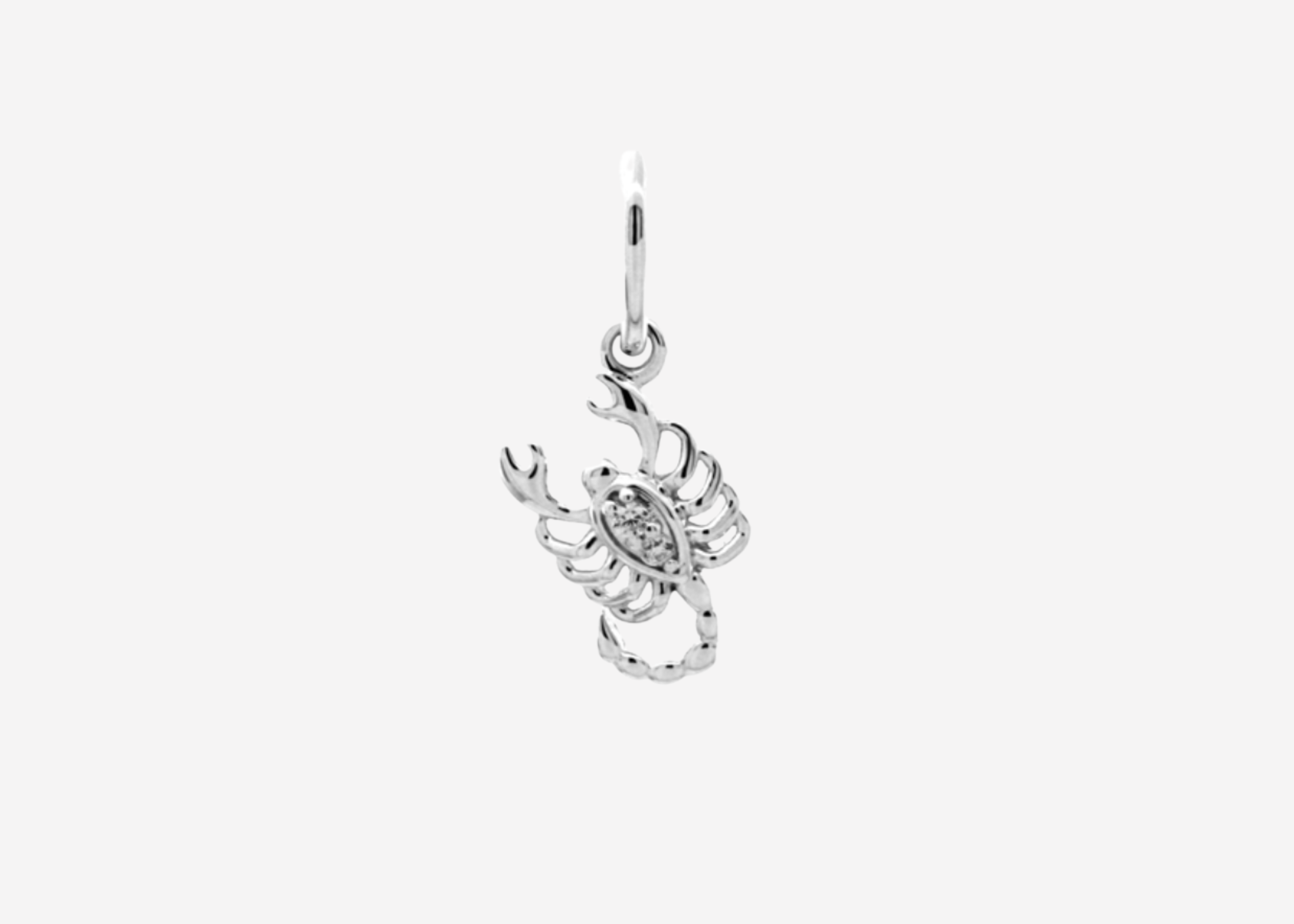 Şener Besim Scorpion Charm in sterling silver with rhodium plating and white stones
