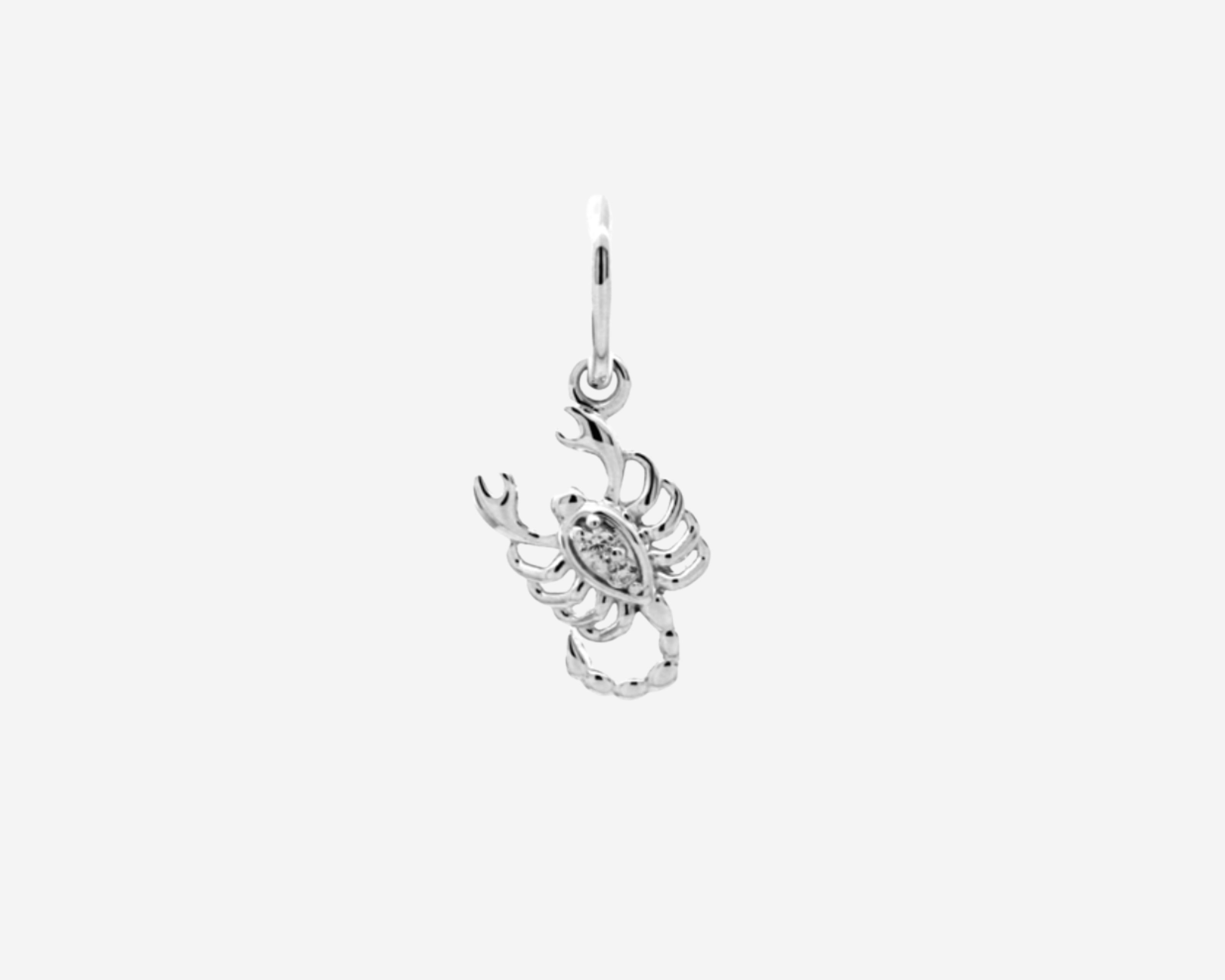Şener Besim Scorpion Charm in sterling silver with rhodium plating and white stones
