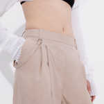 High-waisted tailored pleat pant in sand, waist and hardware detail — Şener Besim