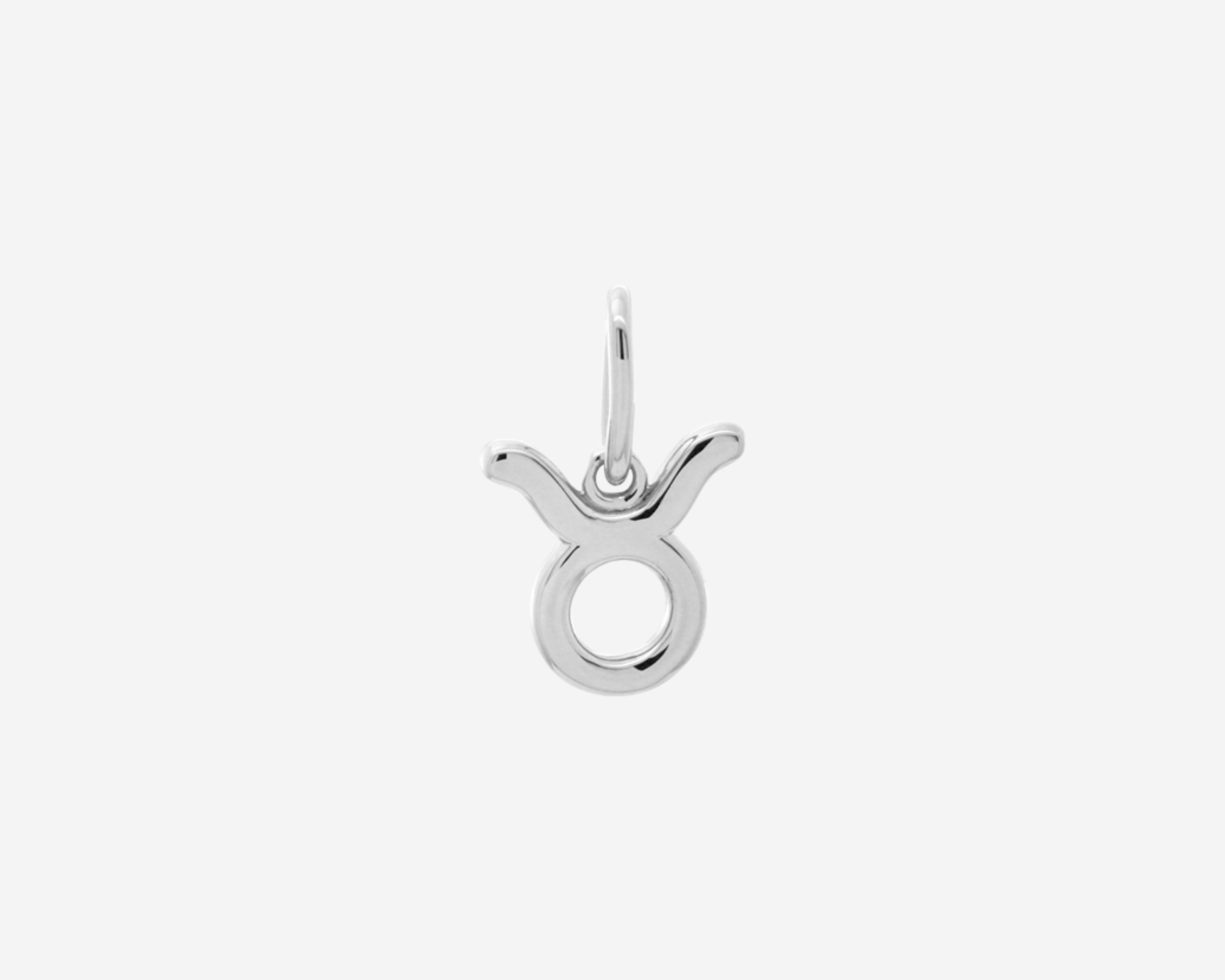 Şener Besim Taurus Charm in silver rhodium plating, flat lay