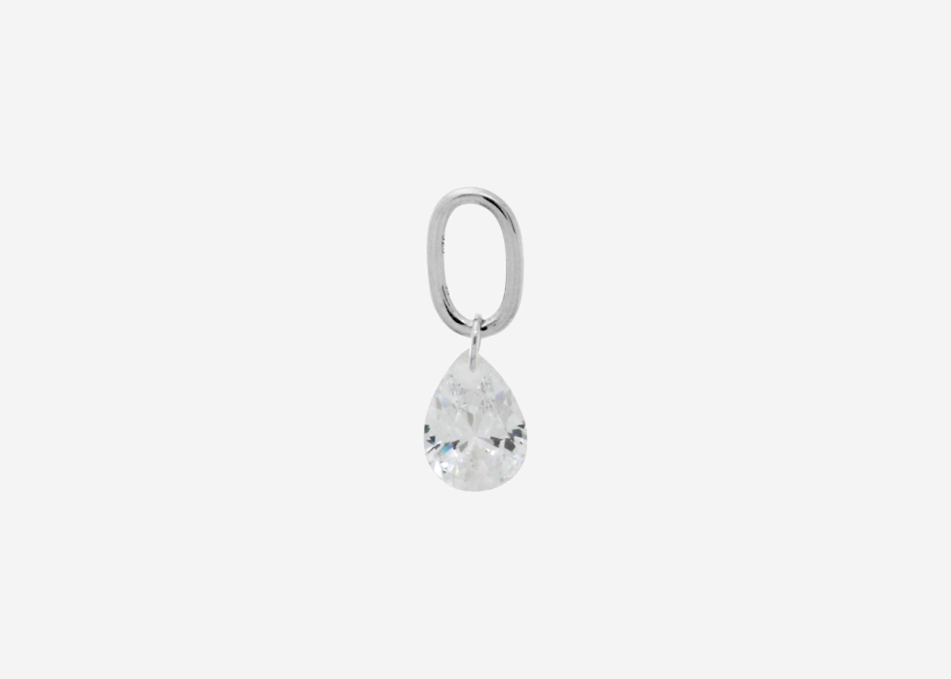 Şener Besim Teardrop Charm with crystal cubic zirconia in rhodium plating, flat lay