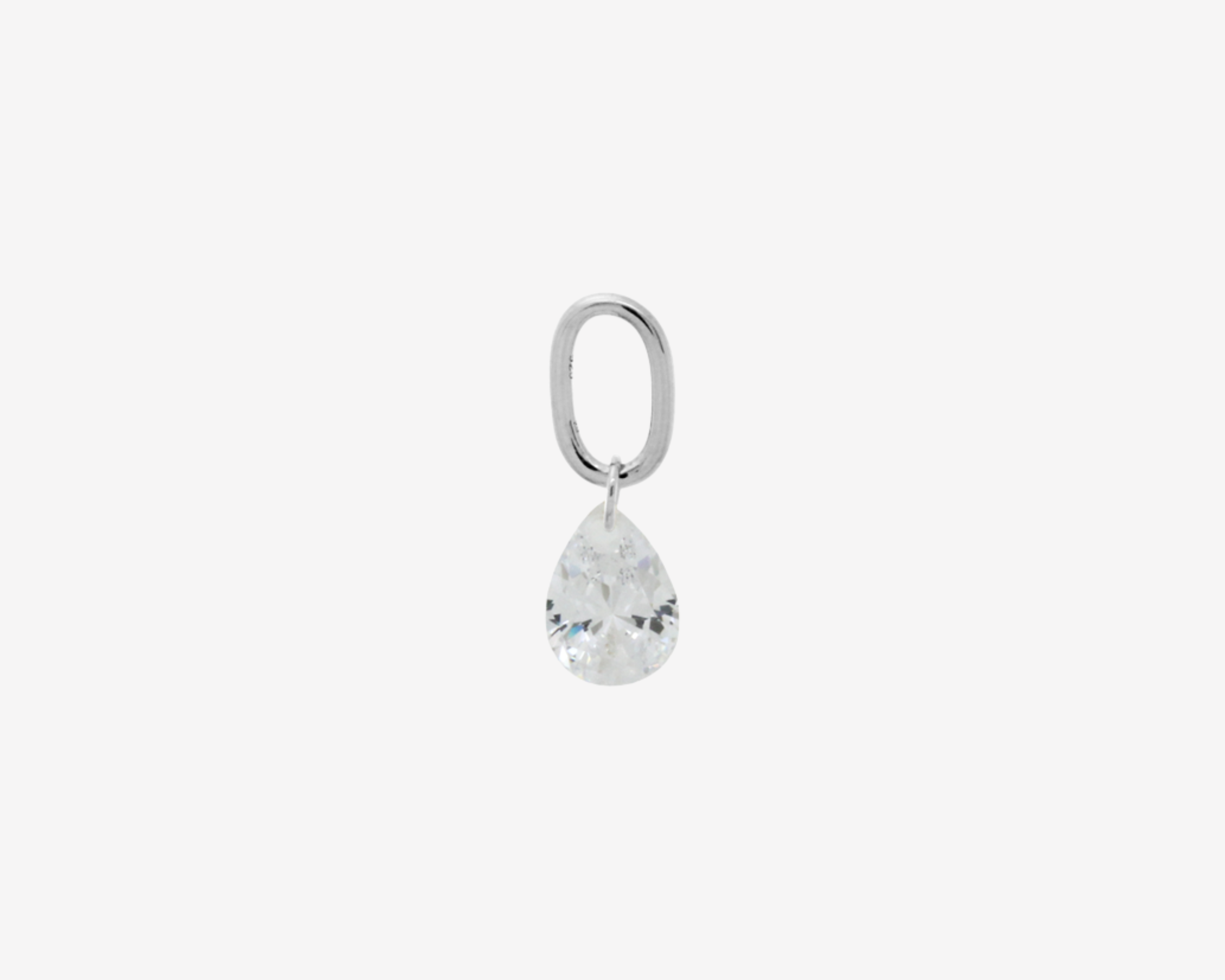 Şener Besim Teardrop Charm with crystal cubic zirconia in rhodium plating, flat lay