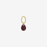 Şener Besim Teardrop Charm with garnet cubic zirconia in gold plating, flat lay