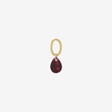 Şener Besim Teardrop Charm with garnet cubic zirconia in gold plating, flat lay