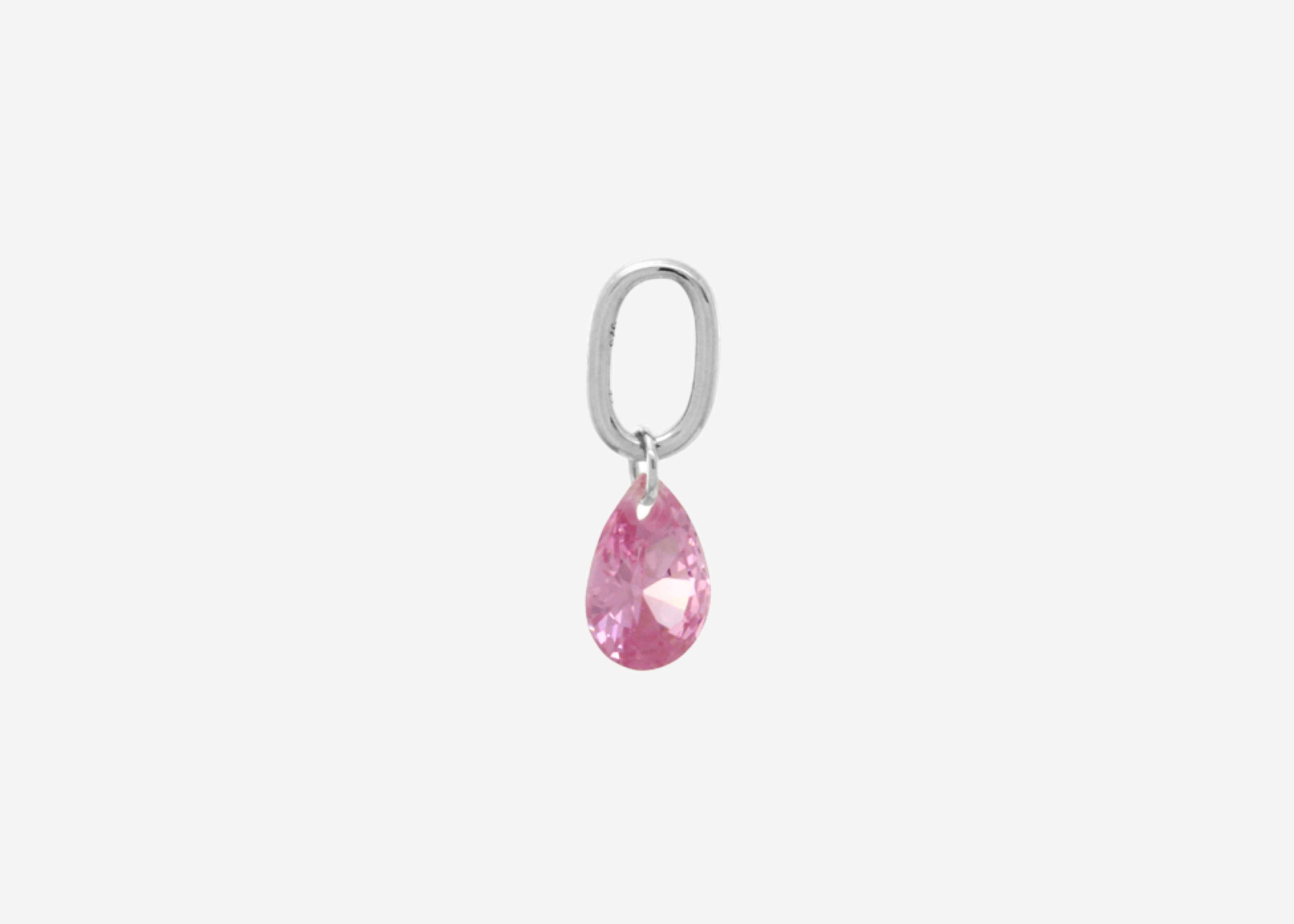 Şener Besim Teardrop Charm with pink rose quartz cubic zirconia in rhodium plating, flat lay